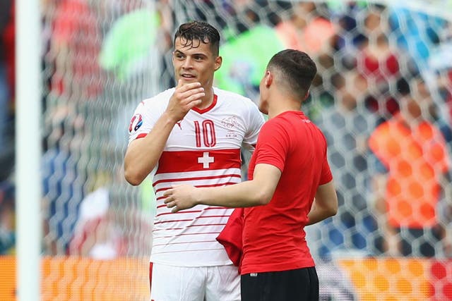 Granit and Taulant Xhaka, who are brothers, played on opposing sides