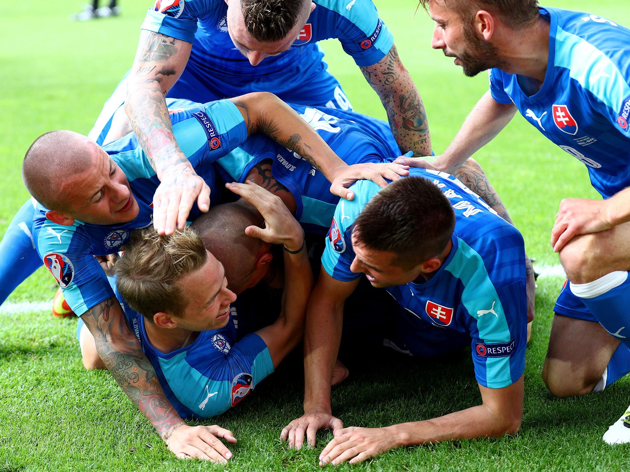 Duda was smothered by his team-mates after levelling for Slovakia