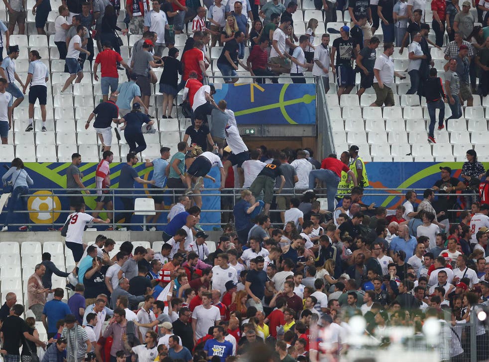 England fans flee from charging Russian supporters at the Stade Velodrome