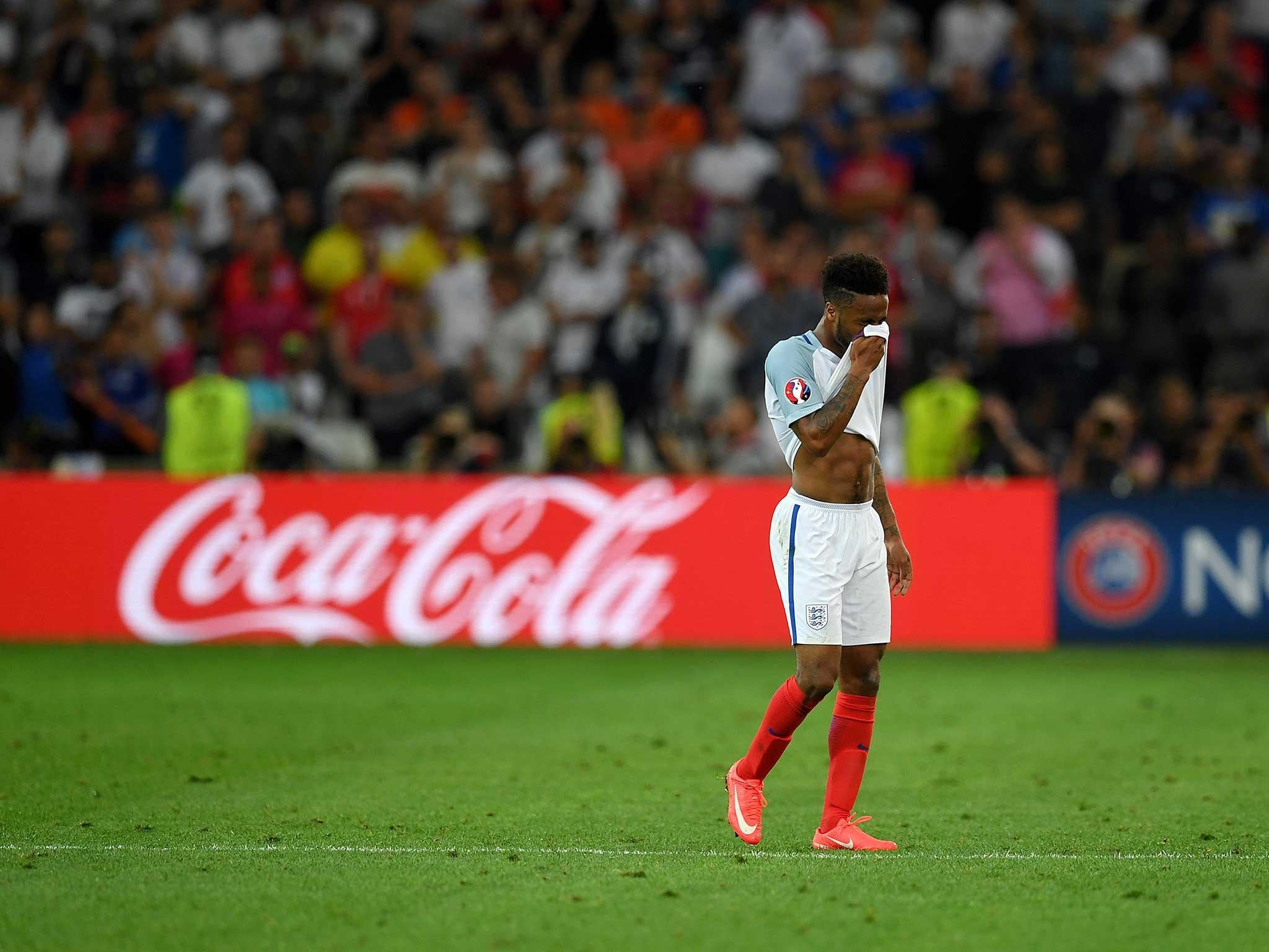 Raheem Sterling looks dejected after the 1-1 draw with Russia