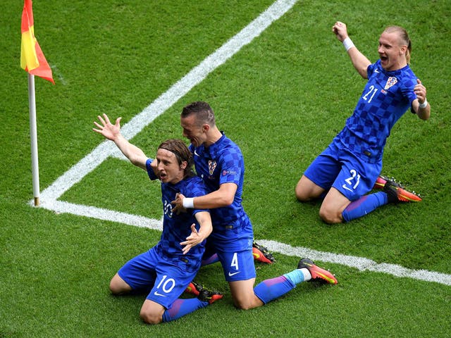 Luka Modric celebrates after opening the scoring for Croatia against Turkey