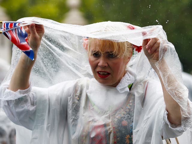 12,500 ponchos were handed out to guests after organisers banned umbrellas