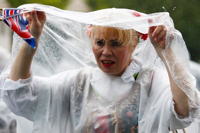 12,500 ponchos were handed out to guests after organisers banned umbrellas