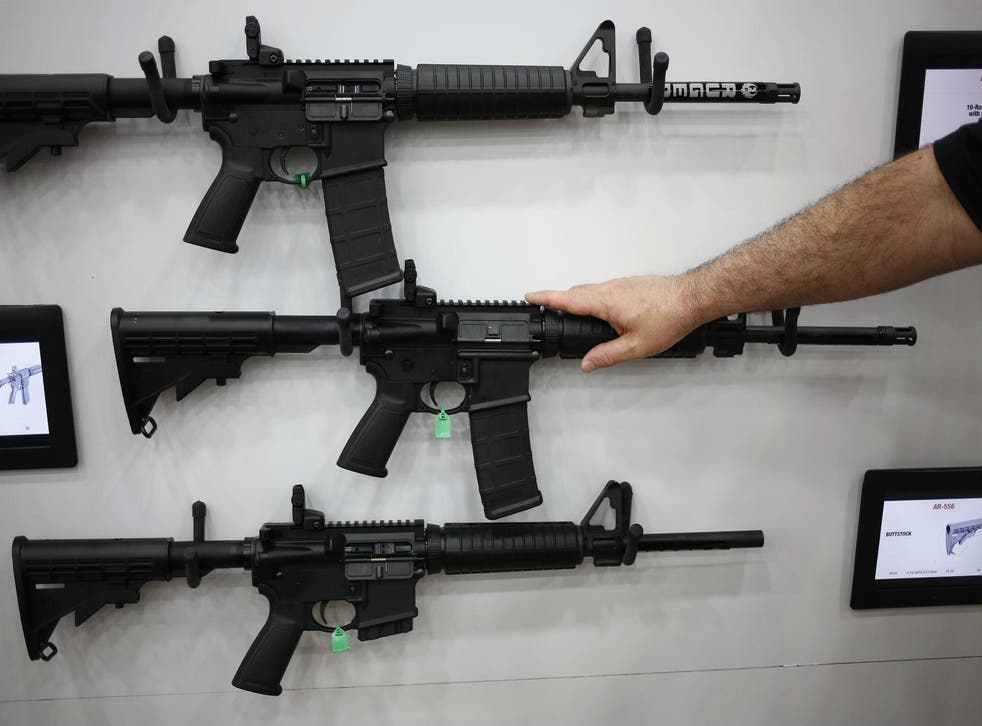 AR-15 style assault rifles, like these photographed at the NRA's annual convention last month, were used by the gunmen in Sandy Hook, Orlando and many other mass shooting incidents