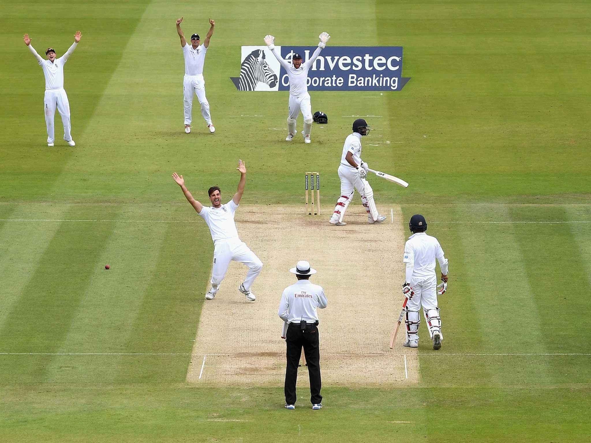 Steven Finn successfully appeals for the wicket of Dinesh Chandimal