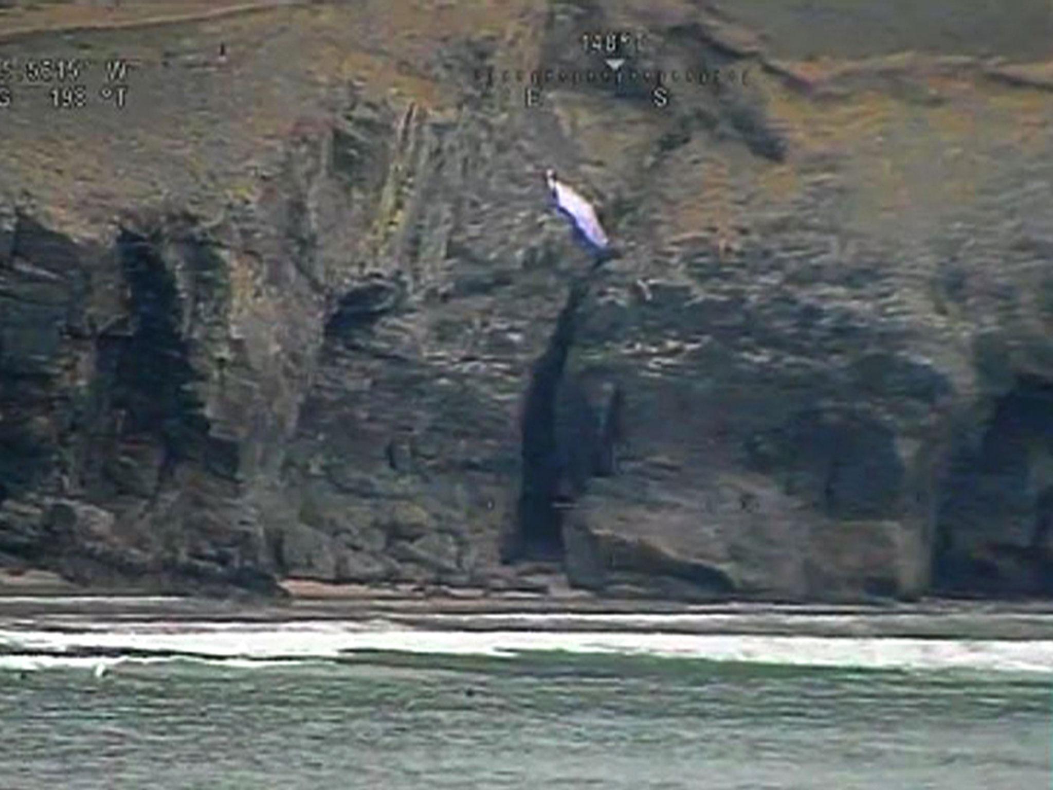 Video grab shows a paraglider rescued by the coastguard in Cornwall
