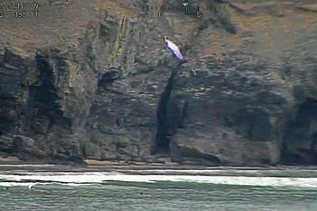 Video grab shows a paraglider rescued by the coastguard in Cornwall