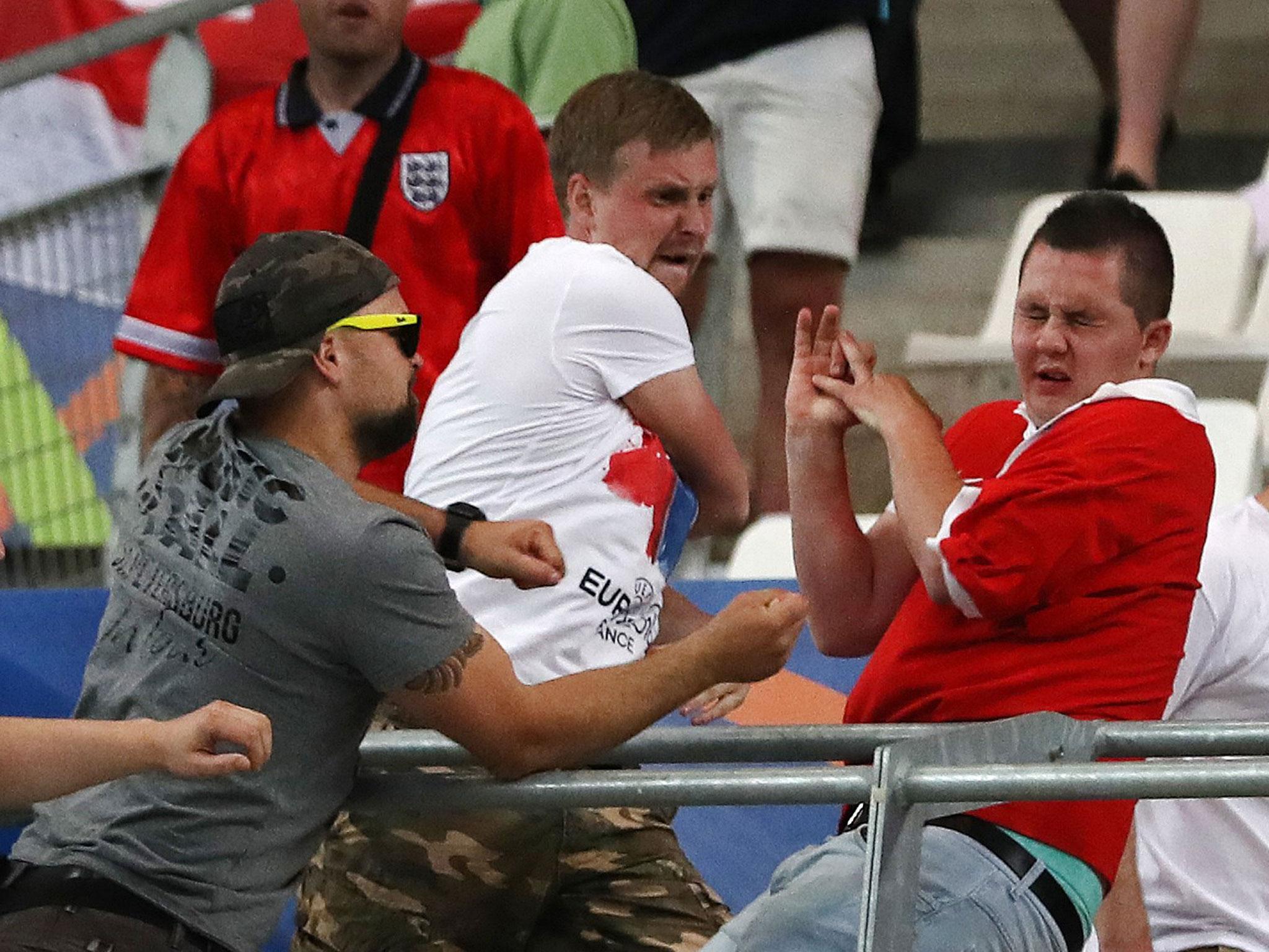 Russian supporters attack an England fan at the end of the Euro 2016 Group B match between England and Russia
