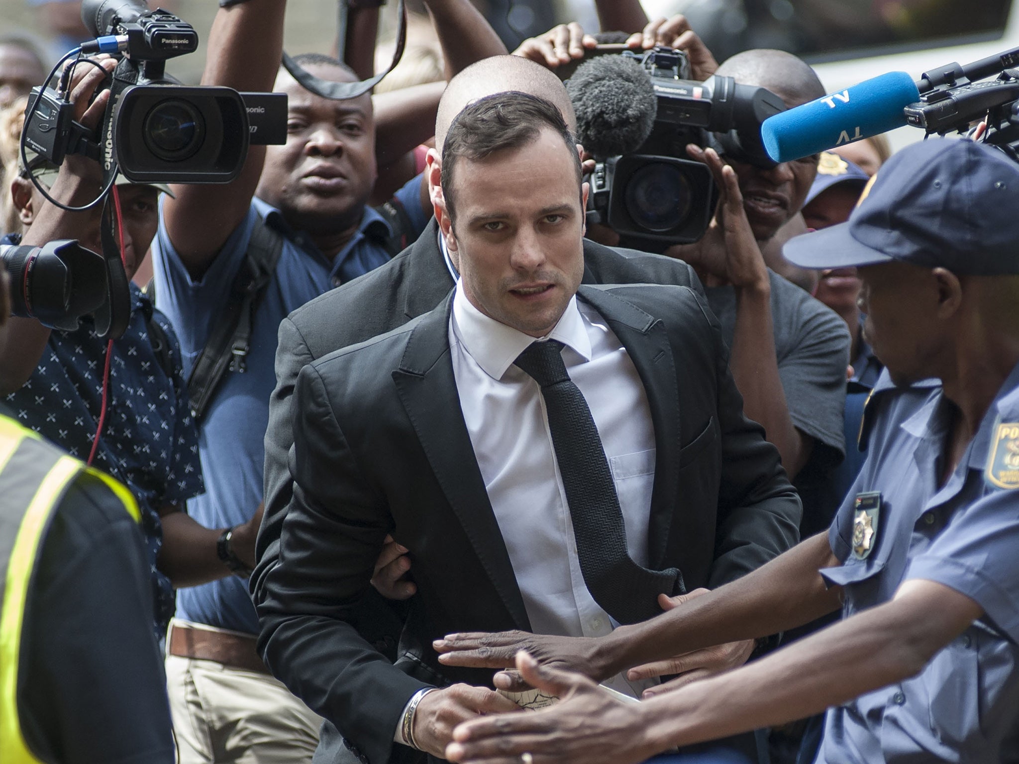 Oscar Pistorius arrives for a court appearance in December 2015 to apply for bail after his manslaughter conviction was upgraded to murder