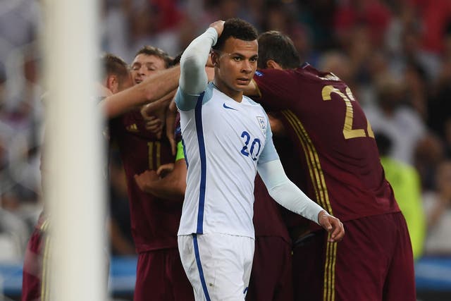 Dele Alli reacts after Russia's late equaliser