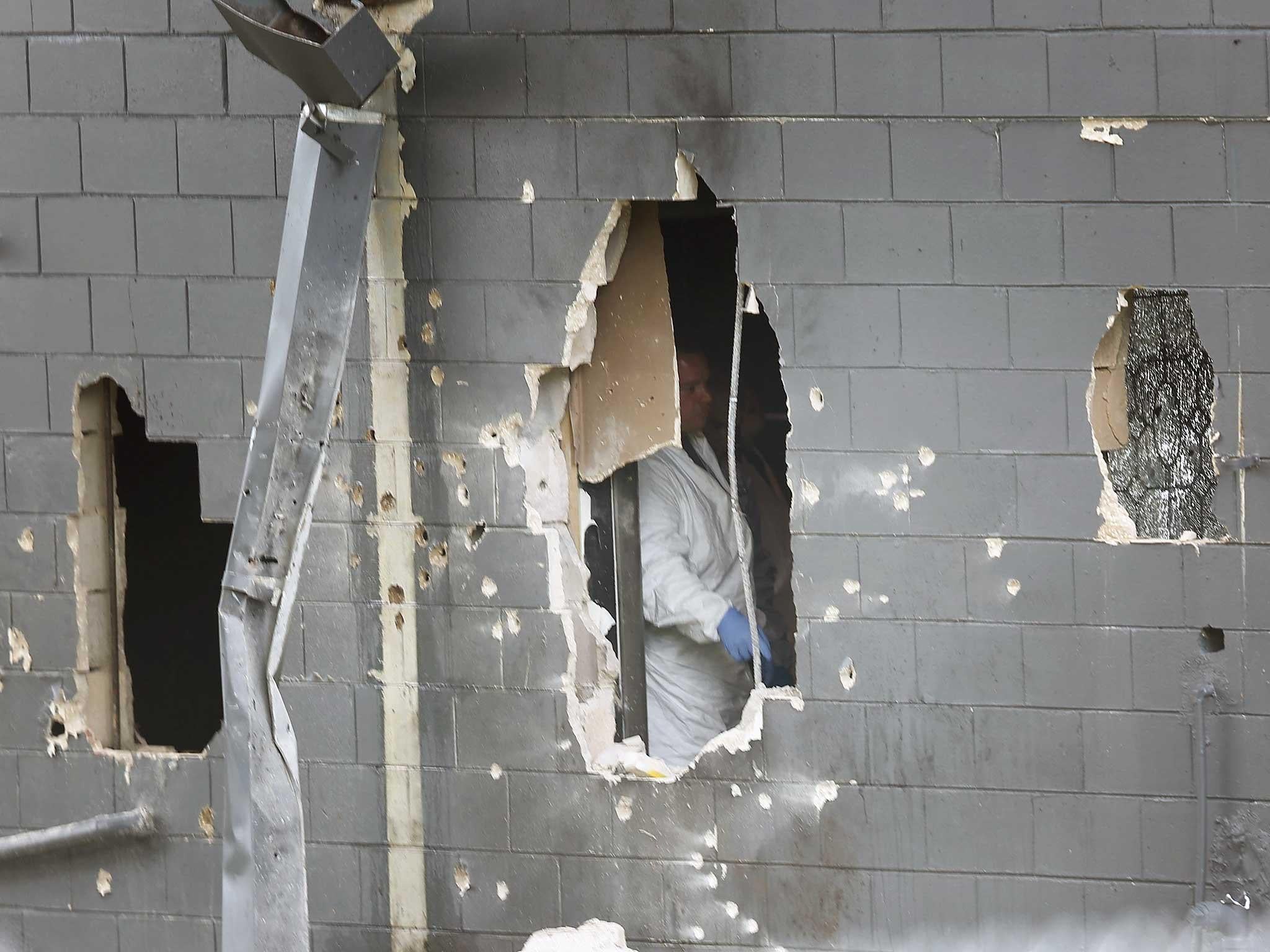 Police blew holes in the bathroom wall to free hostages