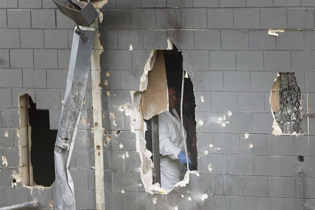 Police blew holes in the bathroom wall to free hostages