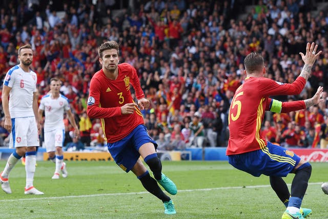 Gerard Pique turns to celebrate heading in the winning goal in Spain's 1-0 victory over Czech Republic