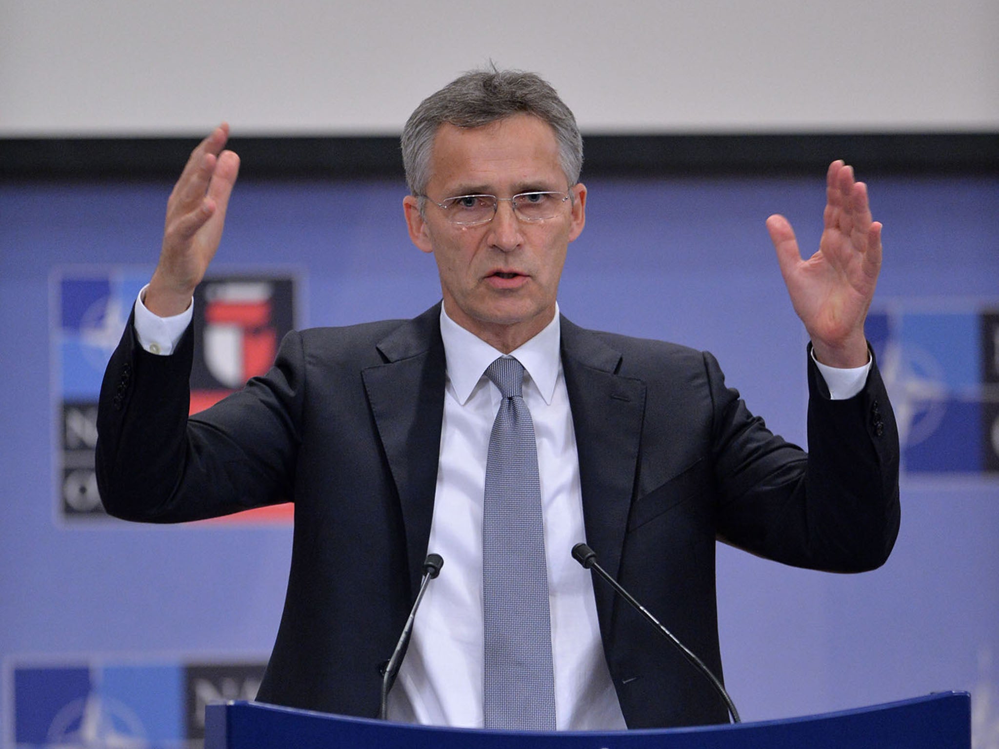 Jens Stoltenberg speaking at a press conference in Brussels