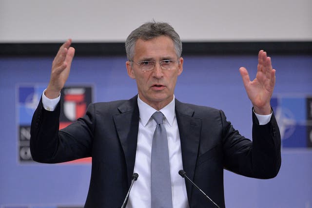 Jens Stoltenberg speaking at a press conference in Brussels