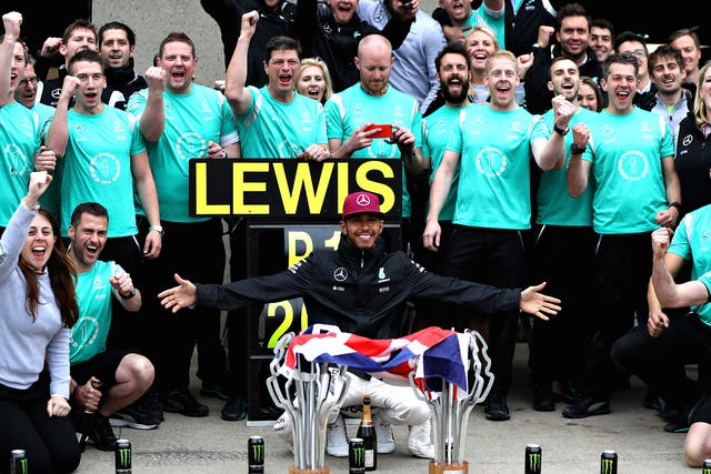Lewis Hamilton celebrates with his Mercedes team after winning the Canadian Grand Prix
