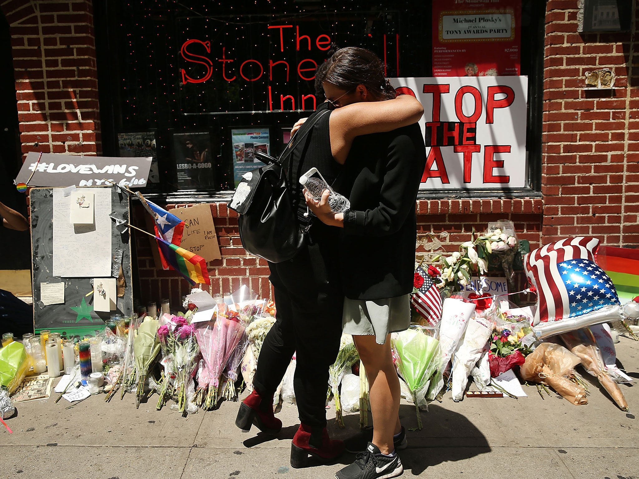 Mourners outside the iconic Stonewall Inn in New York