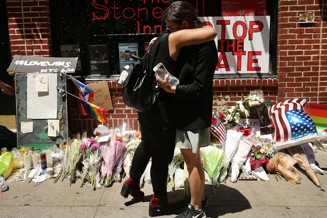 Mourners outside the iconic Stonewall Inn in New York