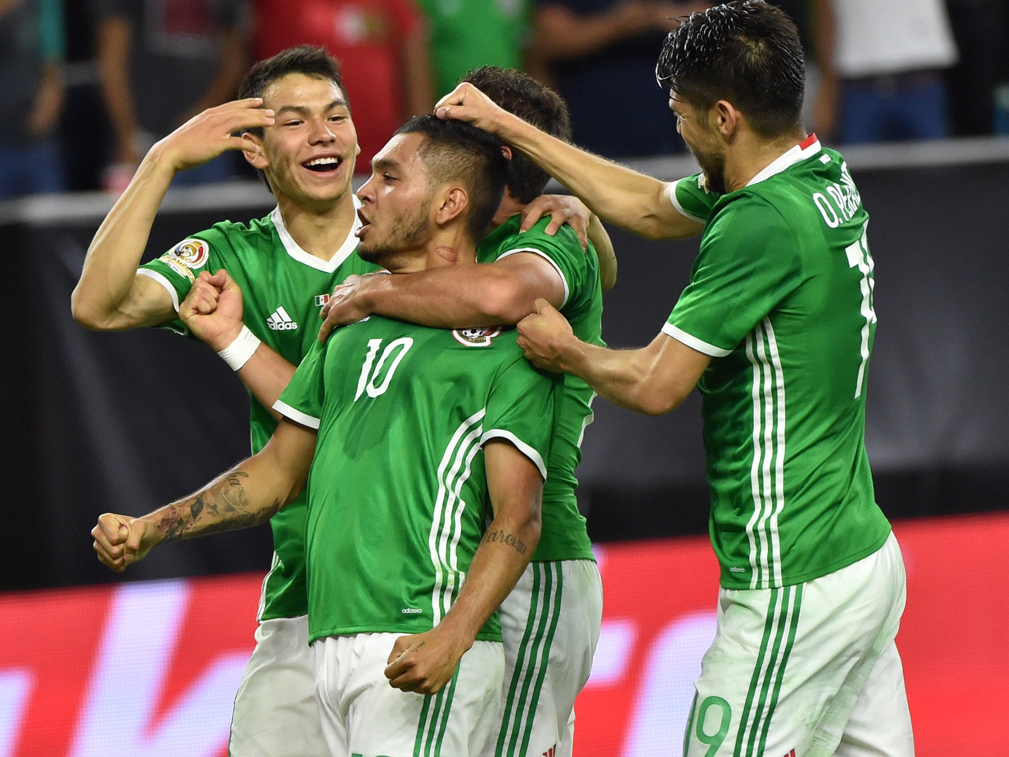 Jesus Manuel Corona celebrates with his Mexico team-mates after scoring against Venezuela