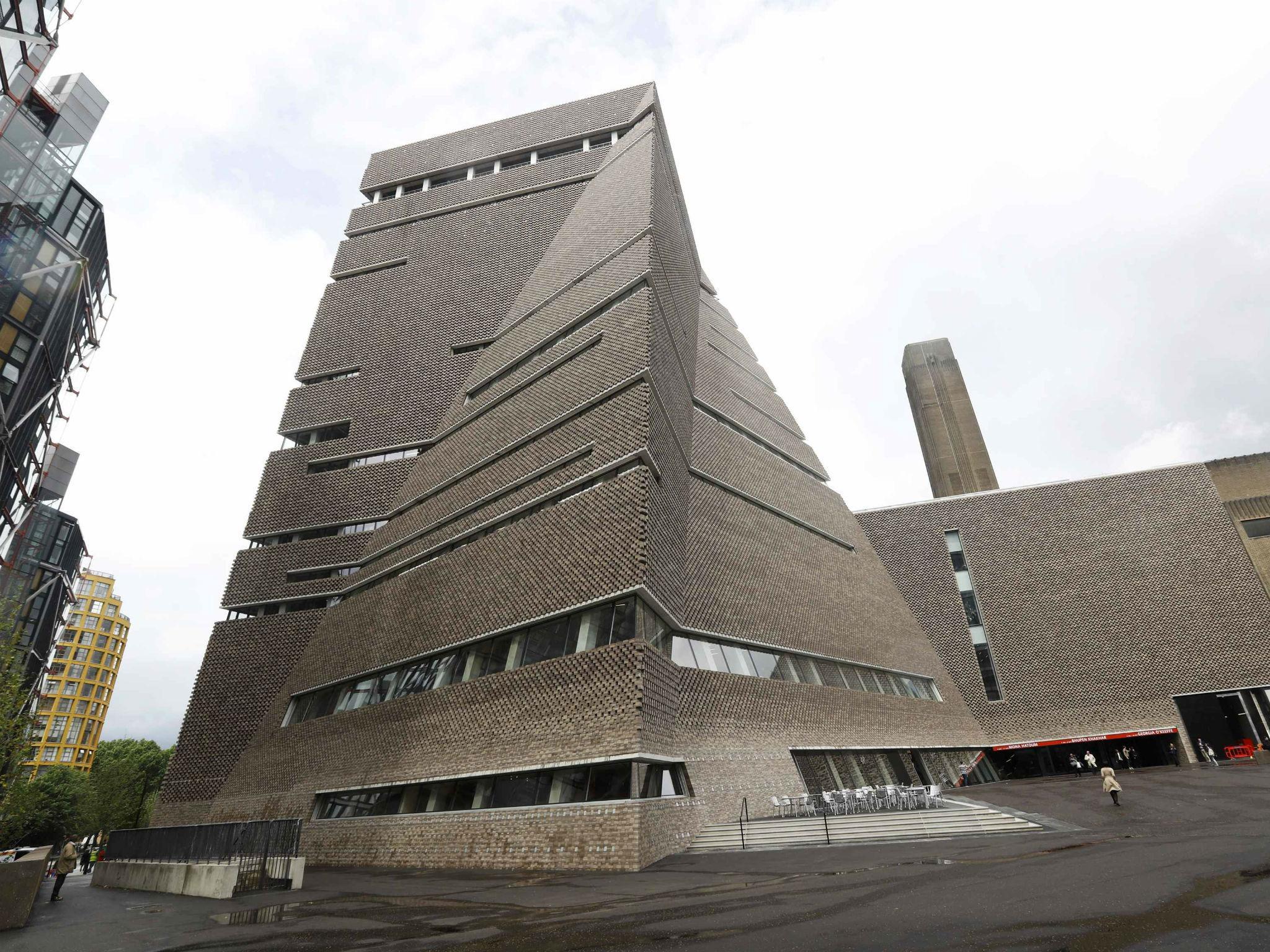 A man stands outside the Switch House during the unveiling of the New Tate Modern in London, Britain, June 14, 2016