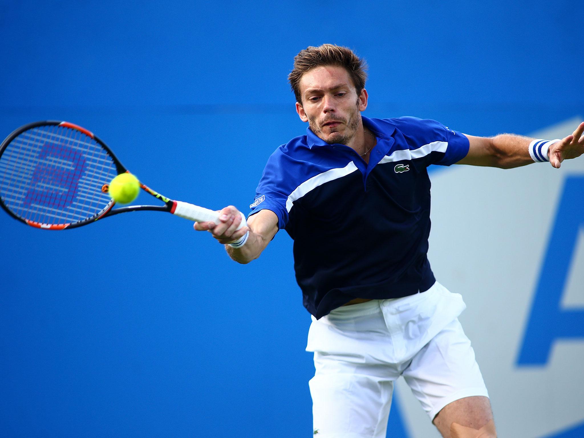 France’s Nicolas Mahut plays a forehand during his first round defeat to Andy Murray