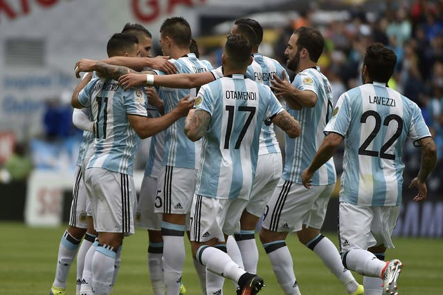 Argentina players celebrate after Erik Lamela's opening goal in the 3-0 win over Bolivia