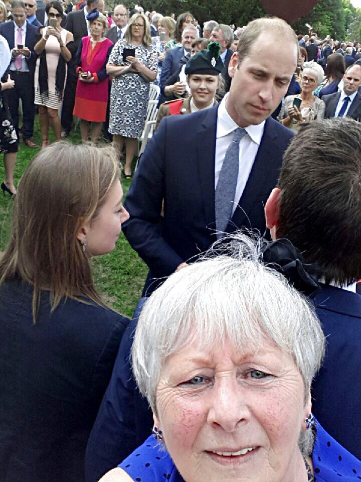 Mrs Hyndman takes a selfie with the Duke of Cambridge in the background