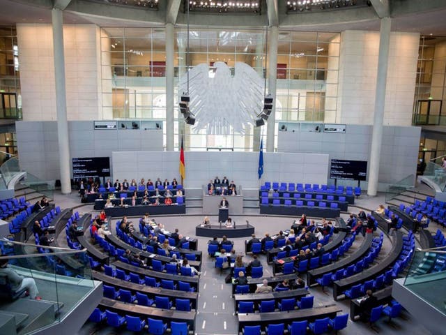 German Minister of Justice Heiko Maas (C) speaks during a session of the German Bundestag in Berlin