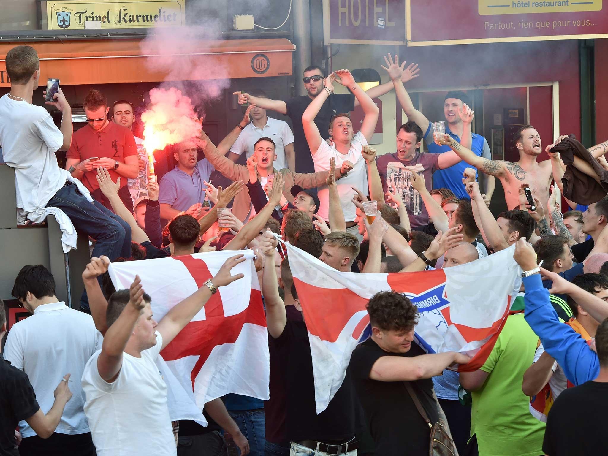 England fans light a flare in Lille