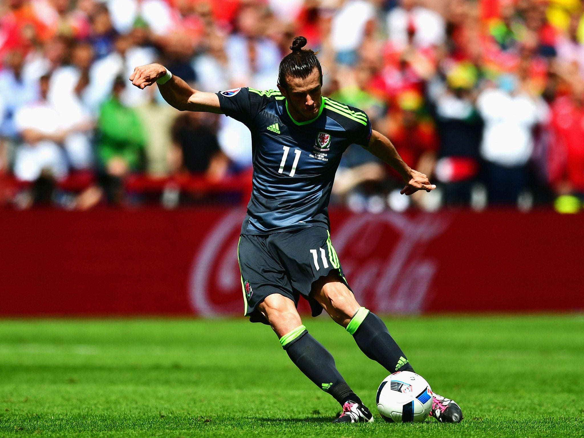 Gareth Bale strikes a free-kick that England goalkeeper Joe Hart can only palm into the net