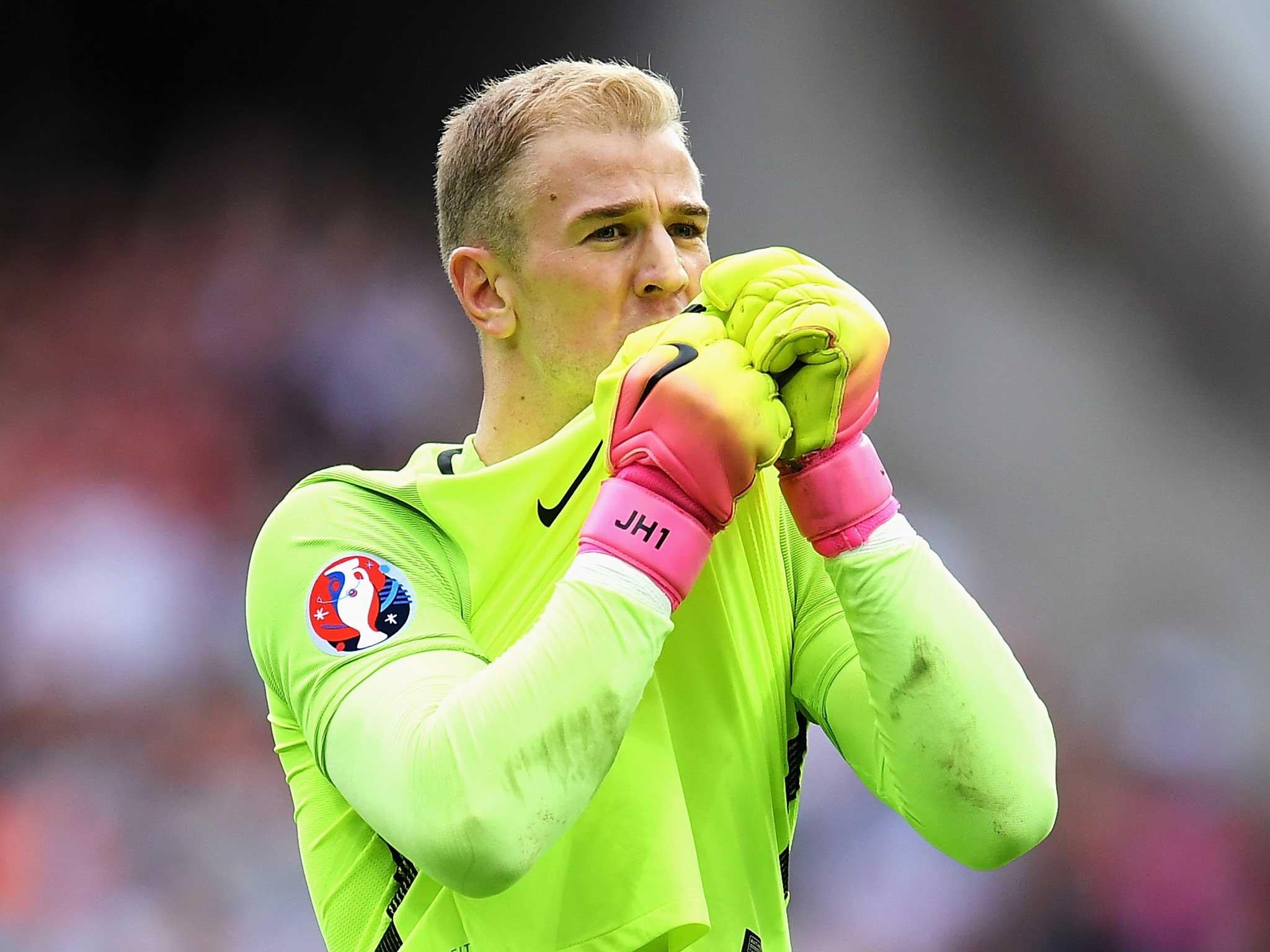 Joe Hart kisses the England badge