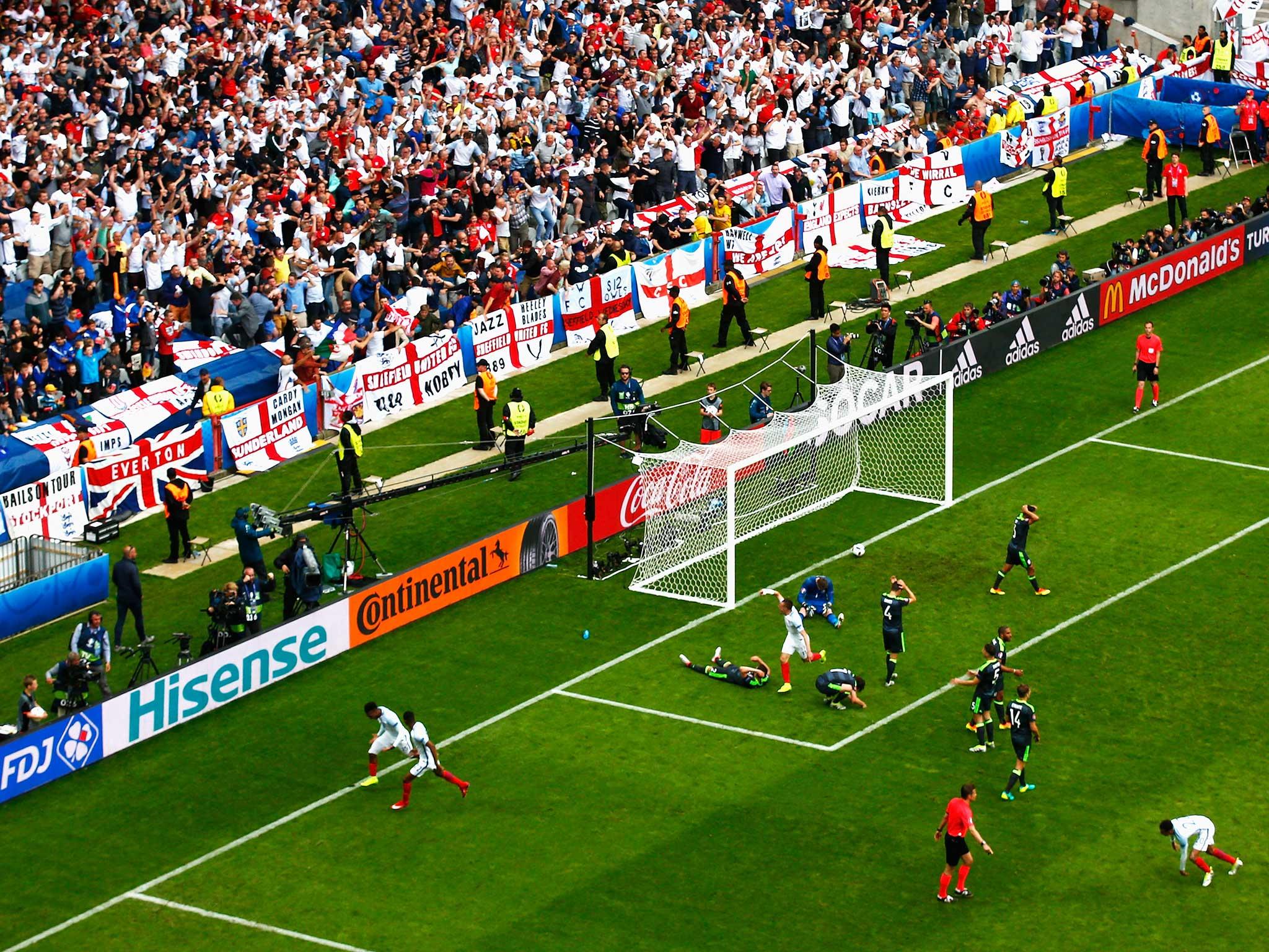 Daniel Sturridge wheels away in delight as England celebrate his last-gasp winner in Lens