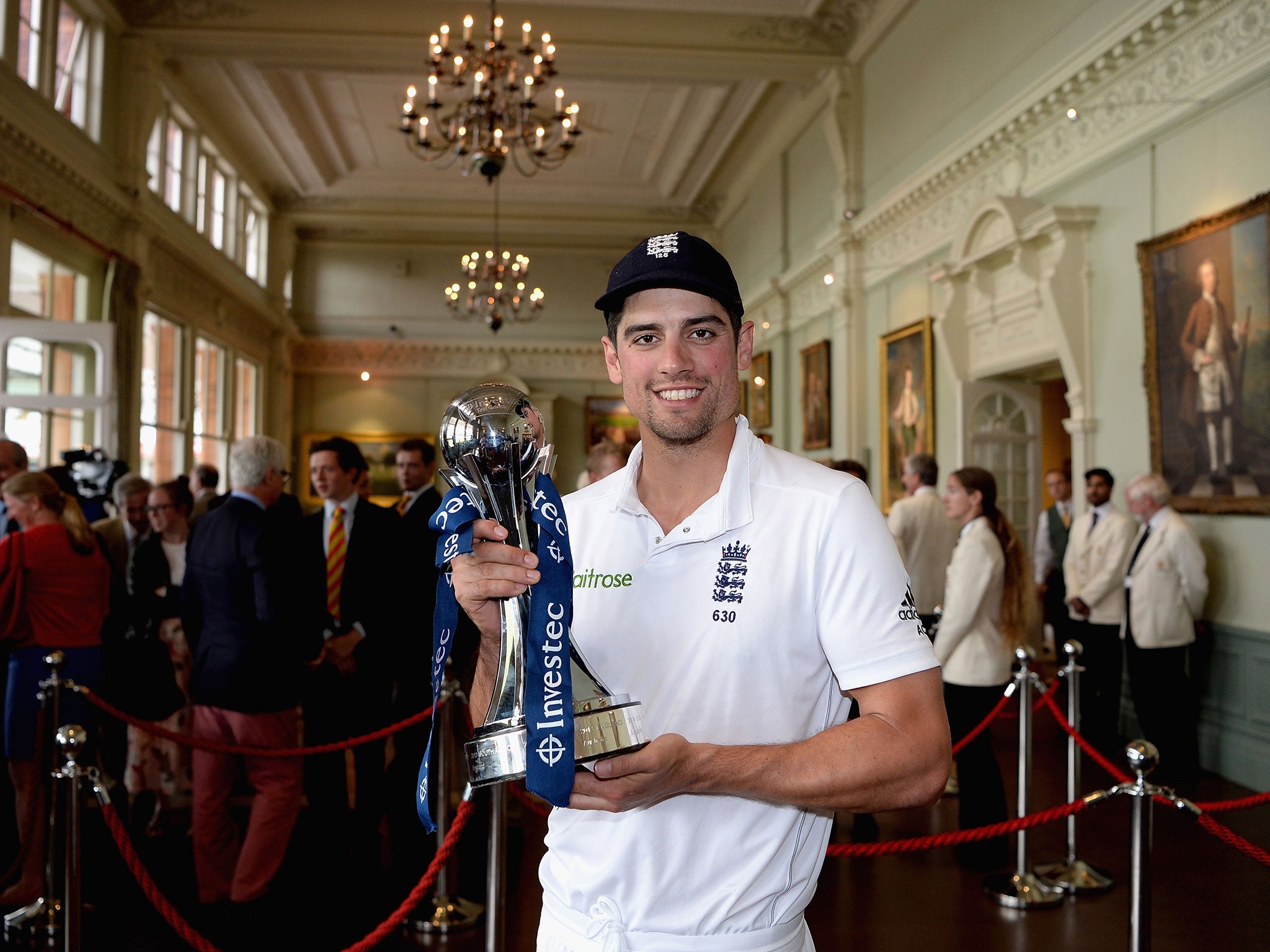 Alastair Cook shows off the trophy for beating Sri Lanka in the Test series - but wouldn't a tri-series have been better?