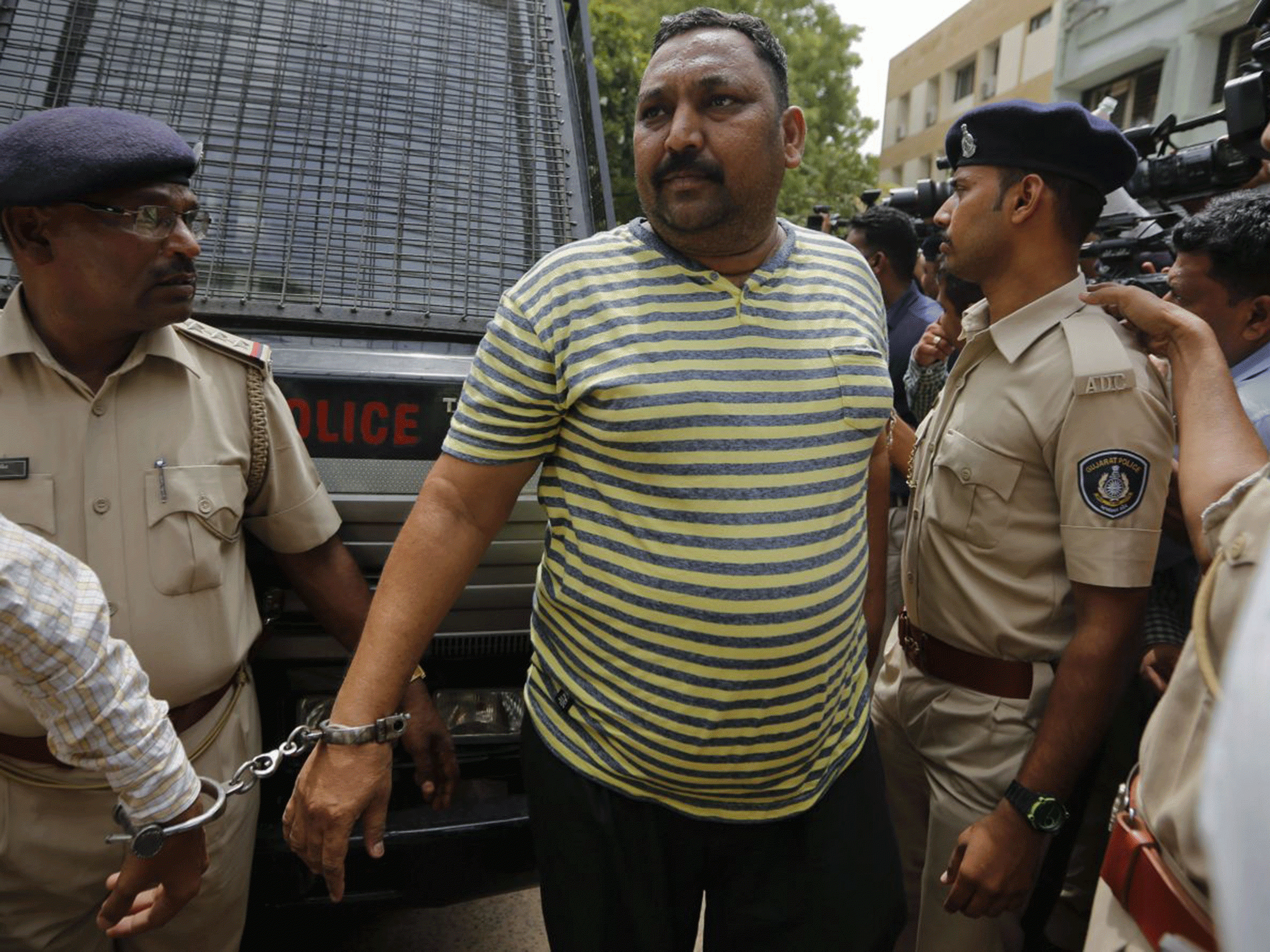 n Indian man convicted for the 2002 Gujarat riots is brought to court in Ahmadabad, India, Friday, June 17, 2016.