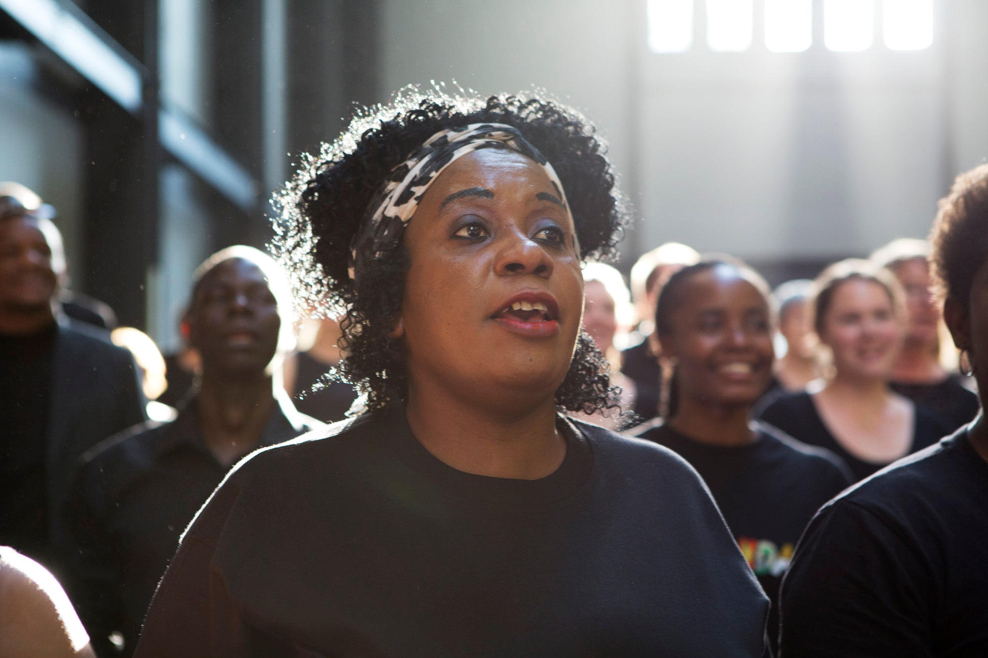 Singers rehearse for a performance of Peter Liversidge's The Bridge, 6 June