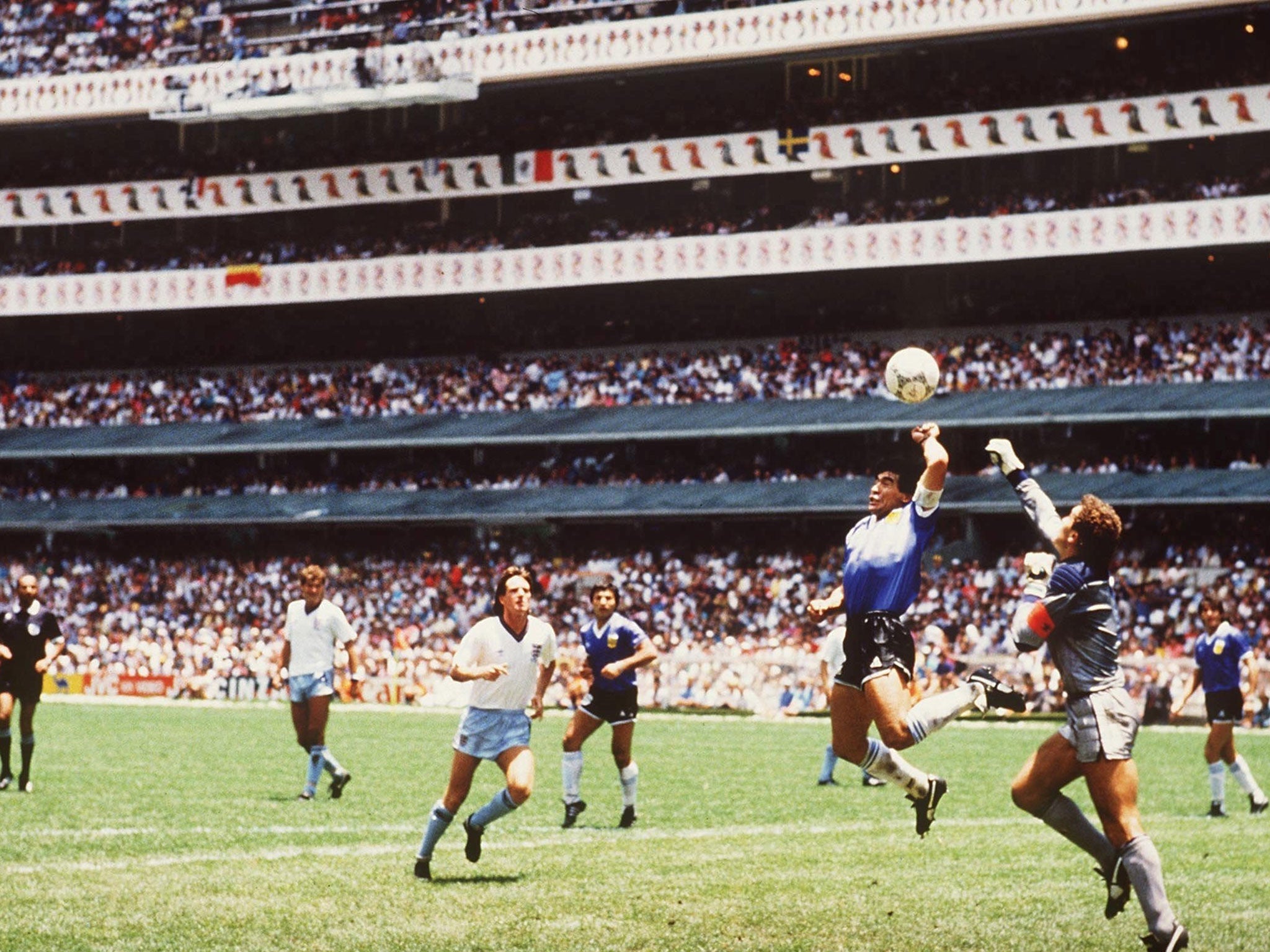 Diego Maradona gets to the ball before Peter Shilton in the World Cup quater-final
