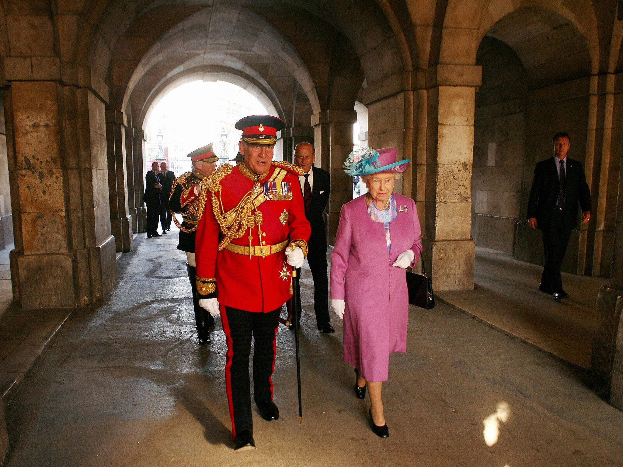 Lord Guthrie (left) former Chief of Defence Staff walks with Queen Elizabeth II at Horse Guards Parade, London