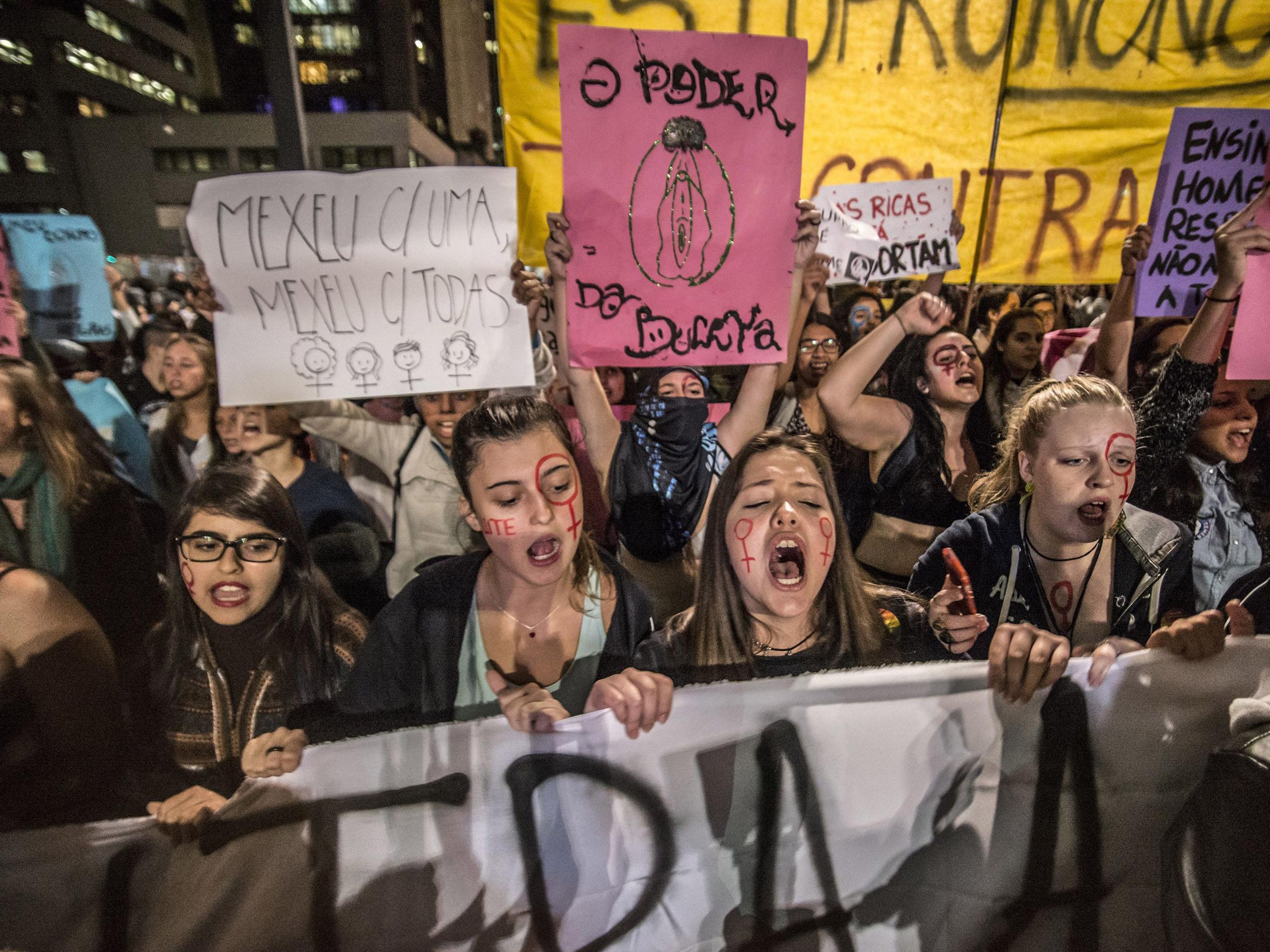 Women in Sao Paulo, Brazil march during a protest following the gang rape of a 16-year-old girl