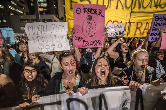 Women in Sao Paulo, Brazil march during a protest following the gang rape of a 16-year-old girl