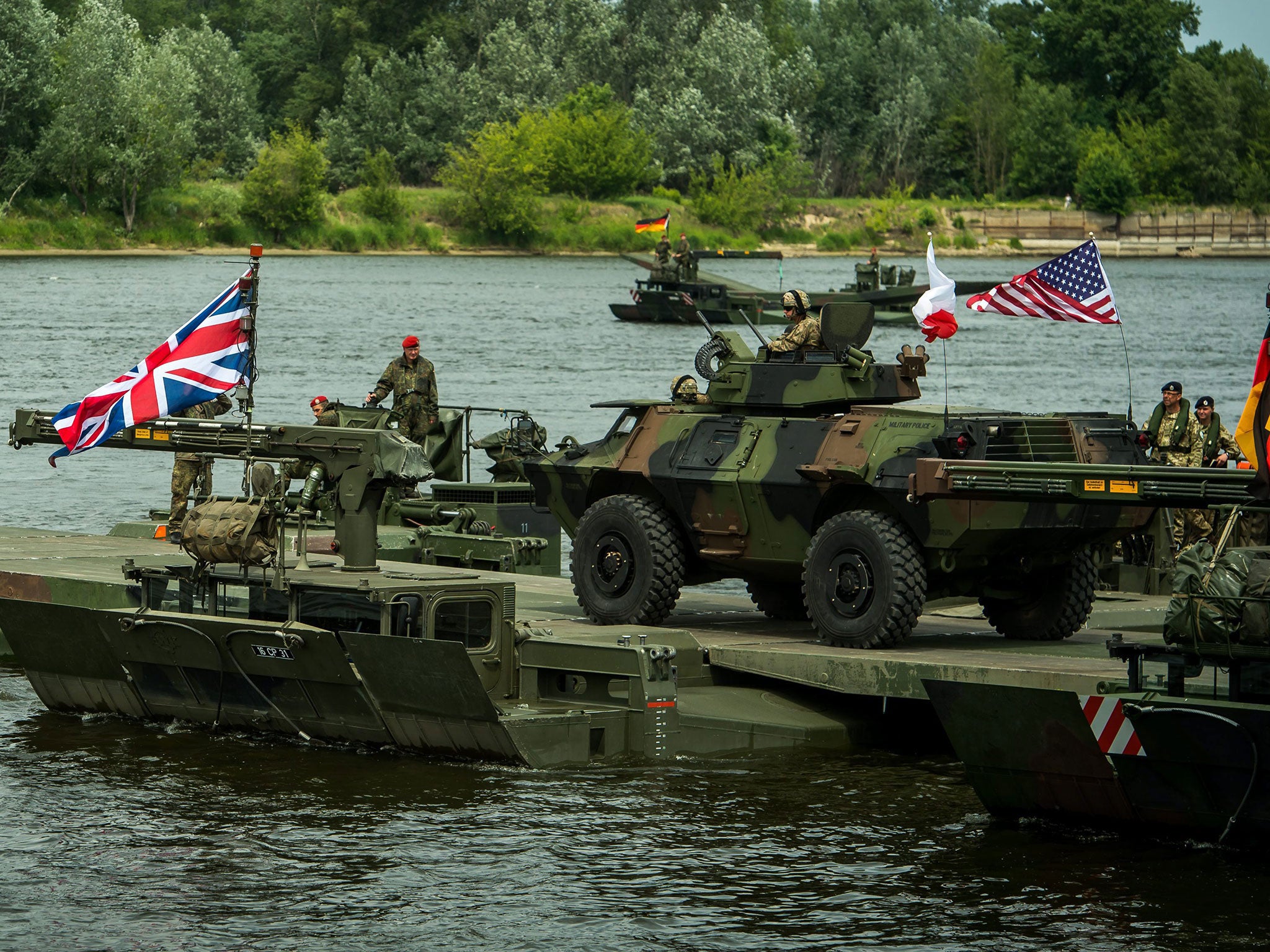 An amphibious bridge across the Vistula river during the NATO Anaconda-16 exercise in Chelmno, Poland, 13 June 2016.