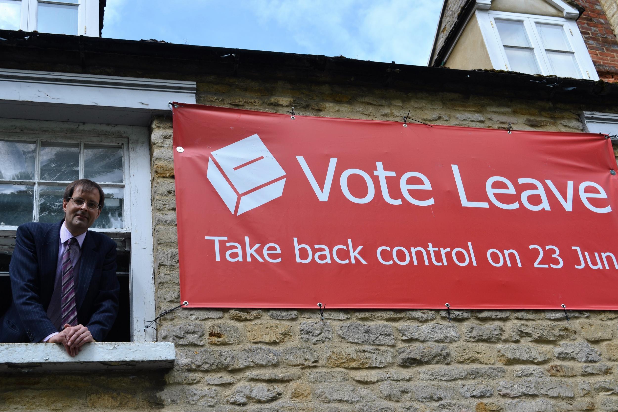 Jonathan Longden at home with his Vote Leave banner