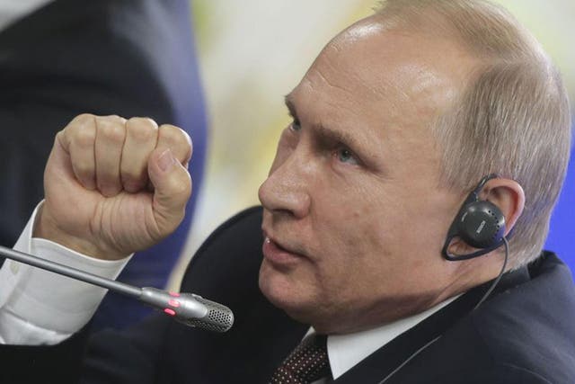 Russian President Vladimir Putin addressing the media