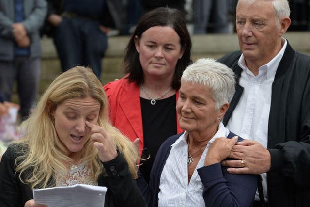 Kim Leadbeater (L), the sister of murdered Labour MP Jo Cox, is joined by her parents Jean (2nd R) and Gordon Leadbeater (R) as she reads a tribute to Jo near to the location where she was killed, in Birstall, Yorks