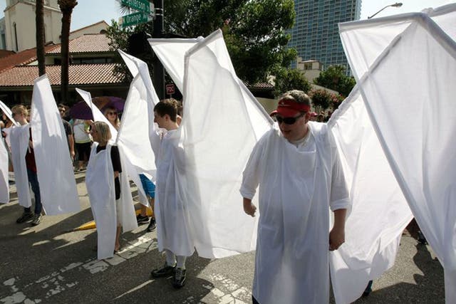 The 'angels' wore large wings to block out protestors at the funerals of victims of the Orlando shootings