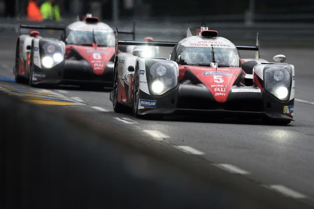 The two Toyotas drive line astern during the Le Mans 24 Hours