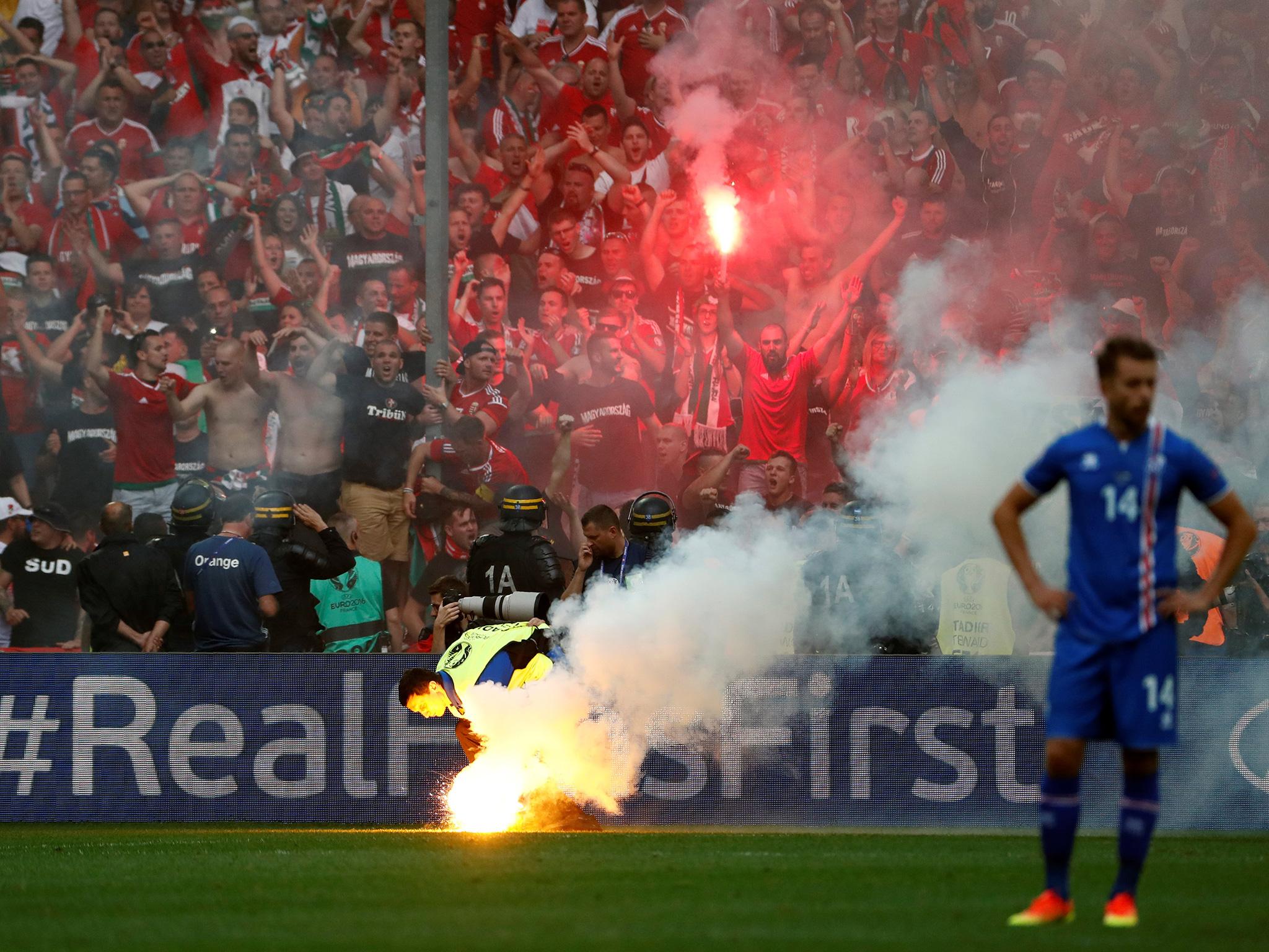 Hungary fans set off flares following their equaliser against Iceland