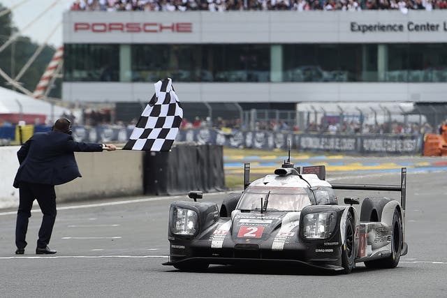 The No 2 Porsche crosses the line to give Neel Jani, Romain Dumas and Marc Leib victory at Le Mans