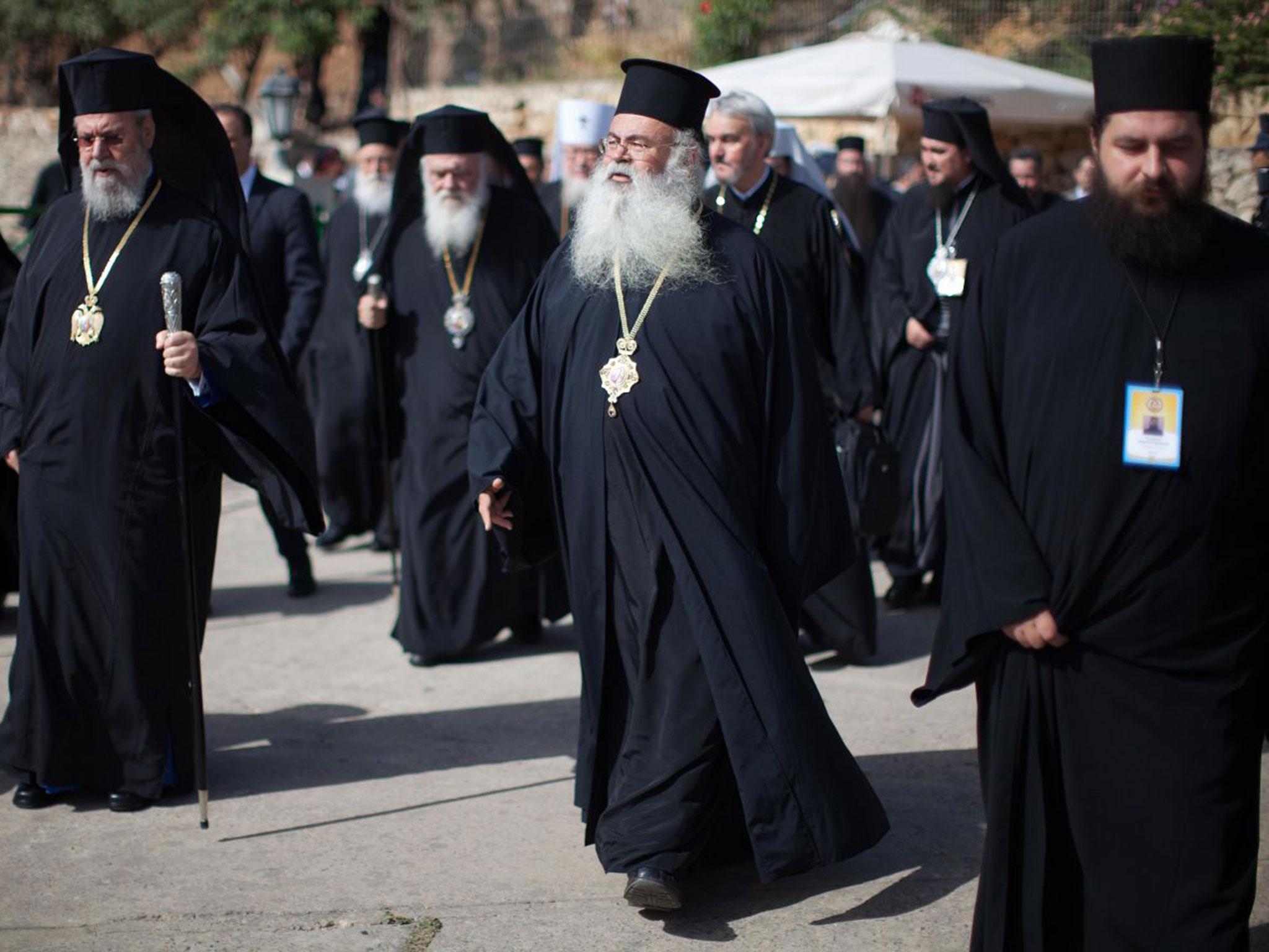 Delegates arrive at the Orthodox Academy of the Greek island of Crete to take part in an meeting between leaders of Orthodox churches.