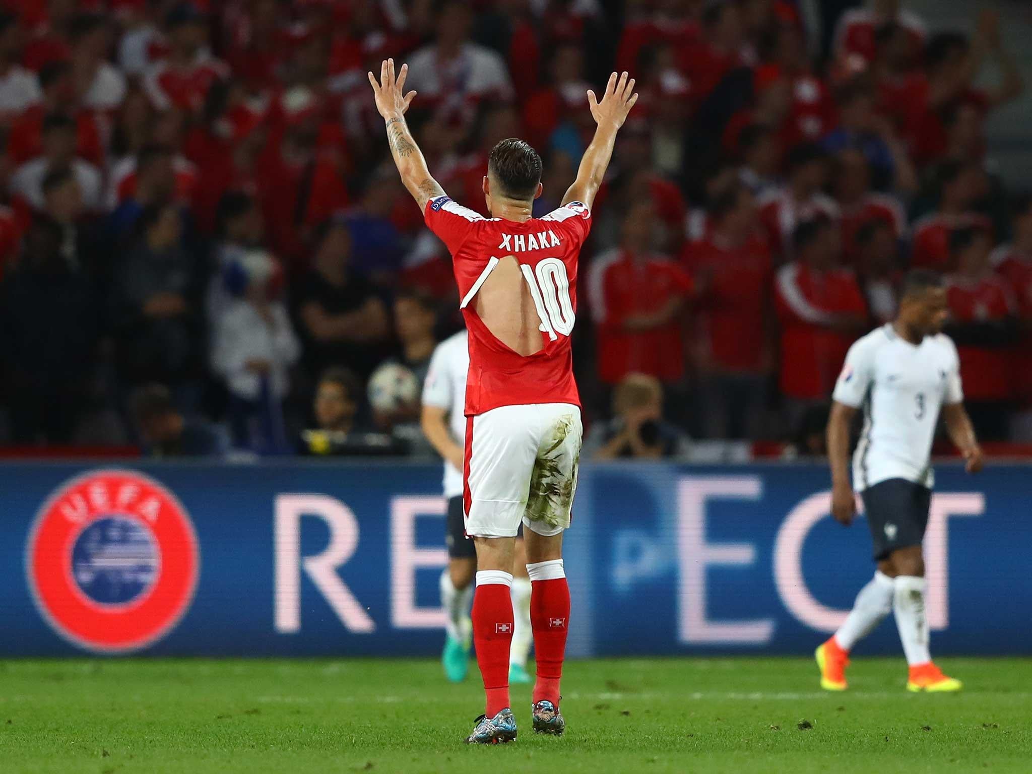 Granit Xhaka's shirt is clearly ripped during Switzerland's match with France