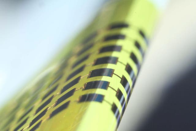 Ultra-thin solar cells are flexible enough to bend around small objects, such as the 1 mm-thick edge of a glass slide.